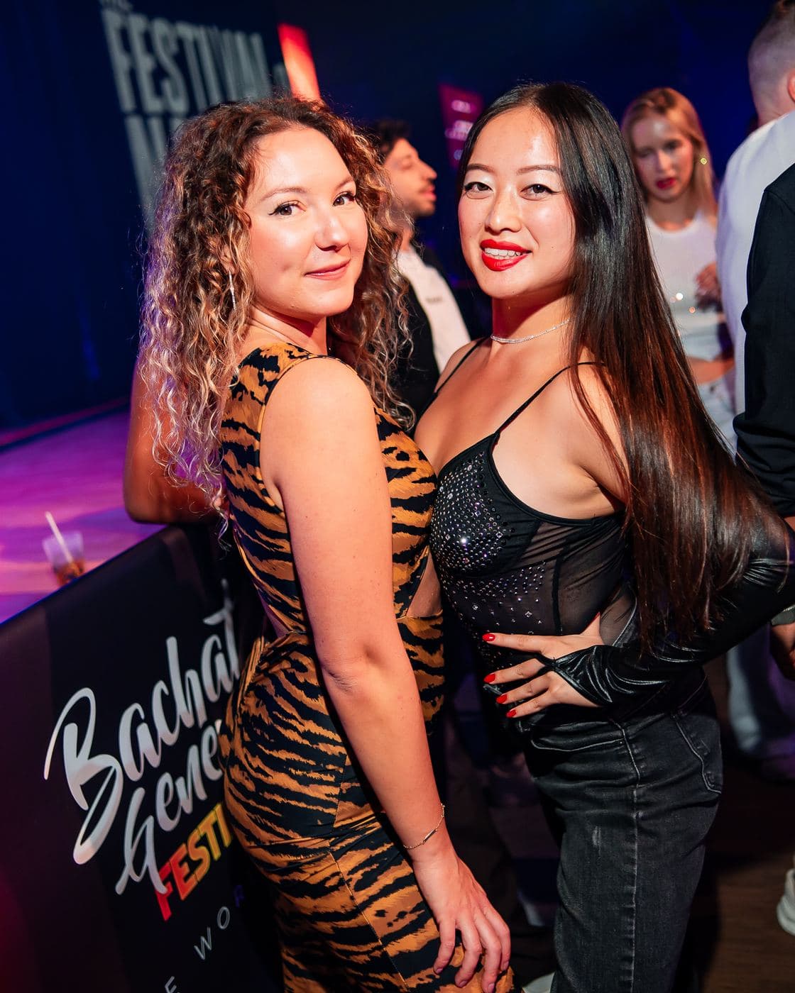 Two friends posing at the night party
