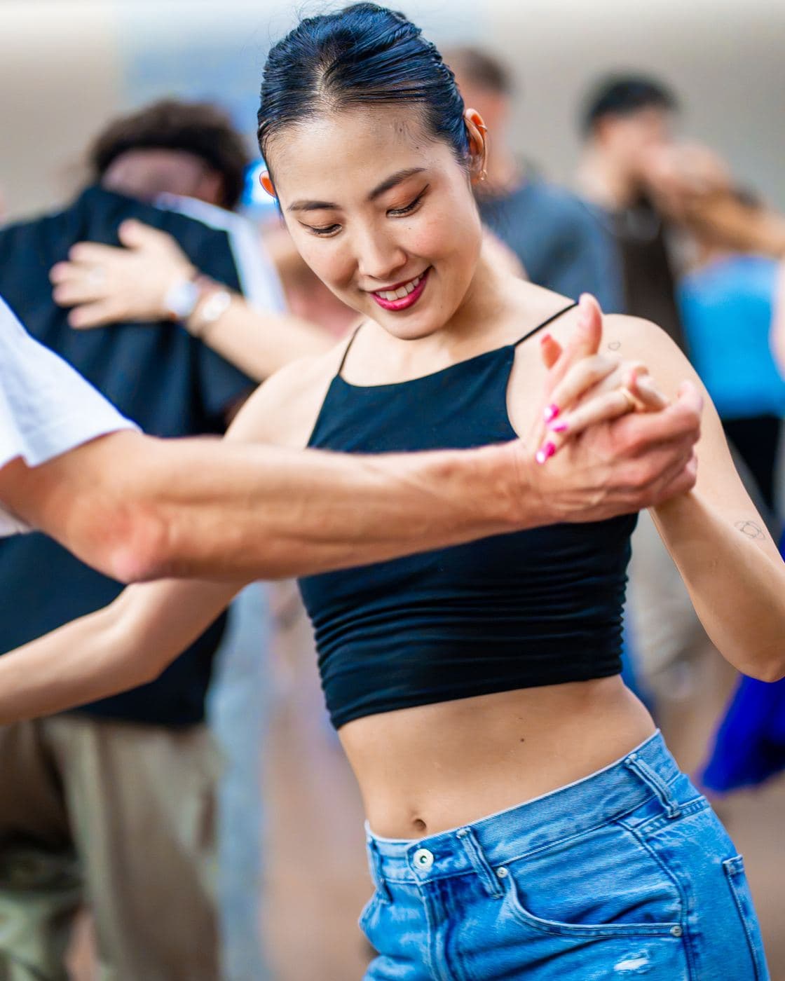 A dancer smiling during a workshop